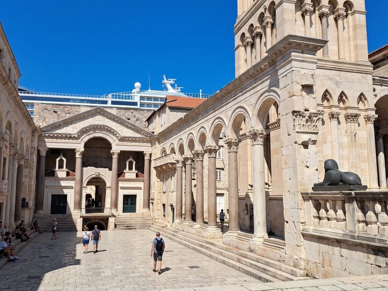 The Peristyle in Diocletian's Palace, Split, with Roman columns and arches and the cathedral bell tower above