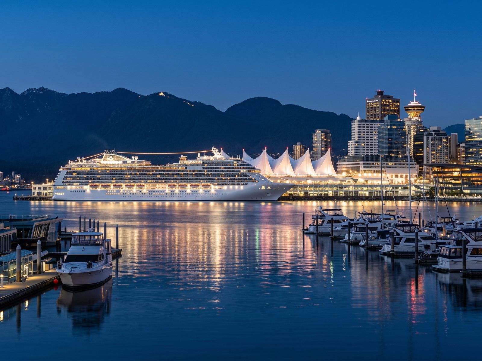 Coal Harbour bij schemering, met de verlichte torens van het centrum, Canada Place en een cruiseschip